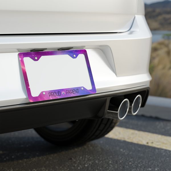 Custom galaxy-themed Proud Parent license plate frame by ATS Elite, made with white aluminum and a glossy finish, featuring vibrant colors and pre-drilled holes for easy installation.